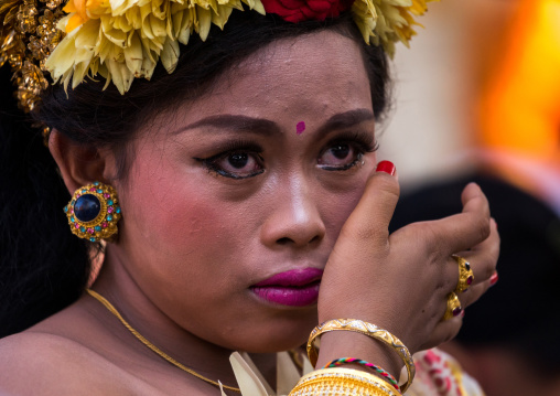 A Teenager Girl In Traditional  Costume Crying Before A Tooth Filing Ceremony