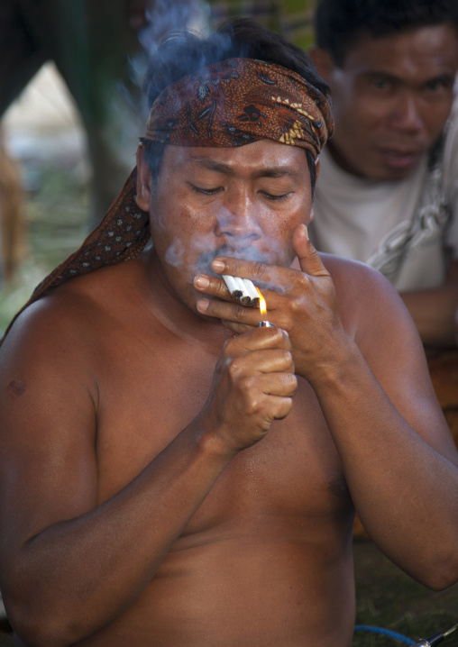 Local Doctor Smoking Cigarettes, Magbesik, Lombok Island, Indonesia