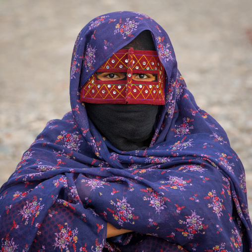 a bandari woman wearing a traditional mask called the burqa at panjshambe bazar thursday market, Hormozgan, Minab, Iran