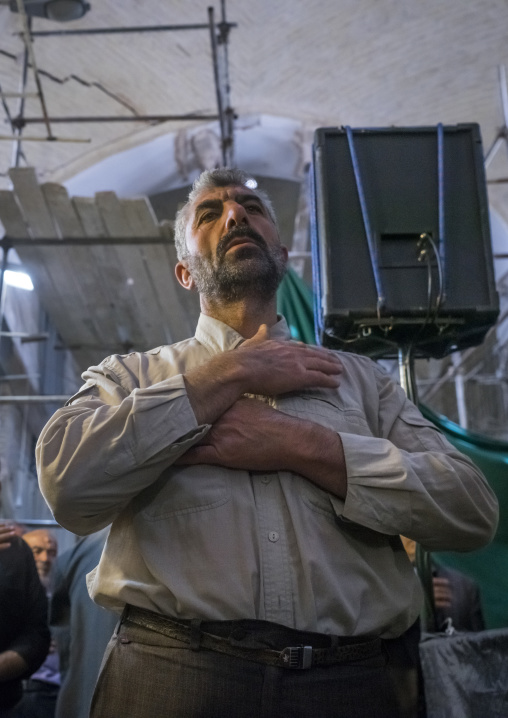 Man weeping and mourning in the bazaar, Isfahan province, Isfahan, Iran