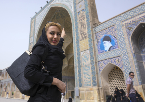 Young woman with blonde hair at the friday mosque, Isfahan province, Isfahan, Iran