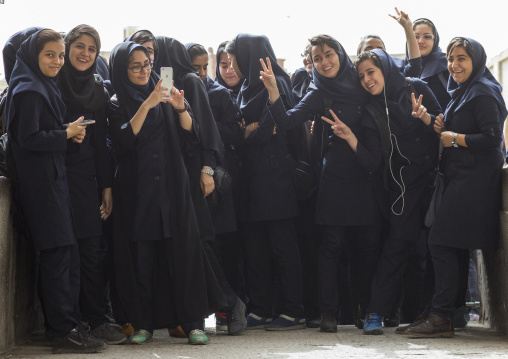 Iranian students women taking pictures with mobile phones, Isfahan province, Isfahan, Iran