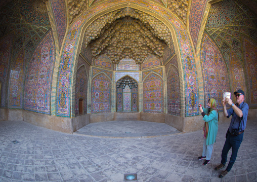 Tourists taking pictures in Nasir ol Molk mosque, Fars Province, Shiraz, Iran