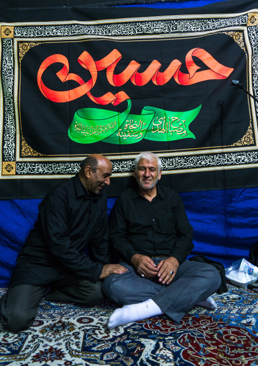Iranian shiite muslim men having a nazri charity diner during Muharram before Ashura celebrations, Central County, Theran, Iran
