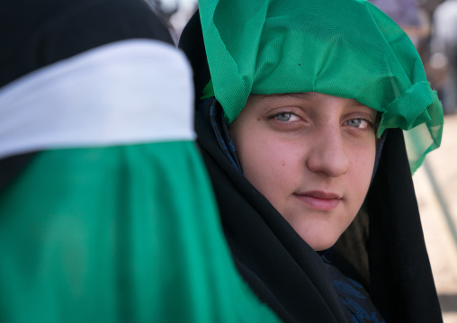 Portrait of a teenage girl with clear eyes during a traditional religious theatre called tazieh about Imam Hussein death in Kerbala, Lorestan Province, Khorramabad, Iran
