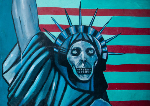 anti-american mural propoganda slogan depict statue liberty skeleton on the wall of the former united states embassy, Central district, Tehran, Iran