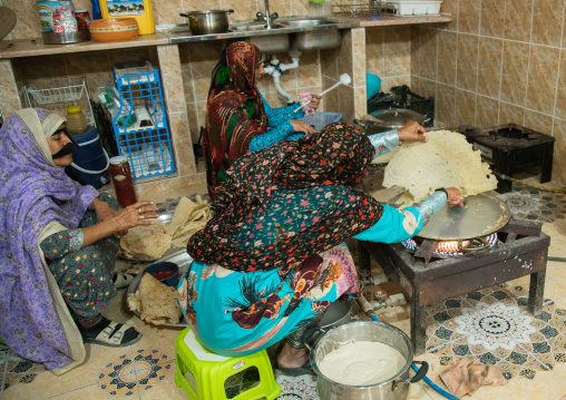 bandari women wearing the traditional masks in a kitchen, Qeshm Island, Salakh, Iran