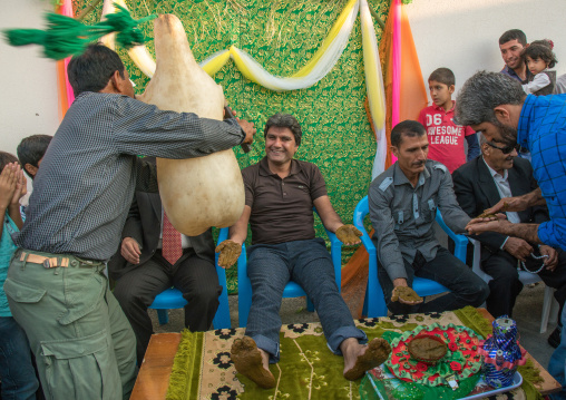 men playing sheep skin pipe bag for the groom during a wedding ceremony, Hormozgan, Kushkenar, Iran