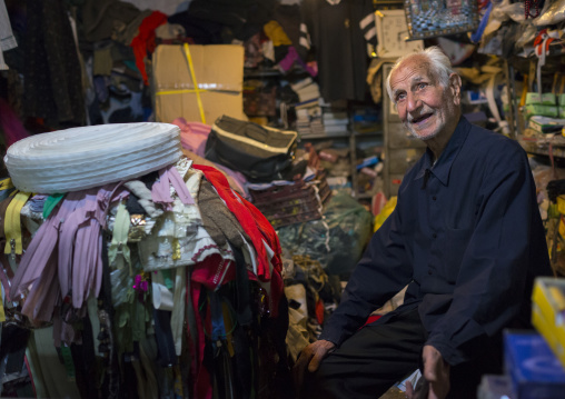 Old Man Selling Clothes In The Bazaar, Kermanshah, Iran