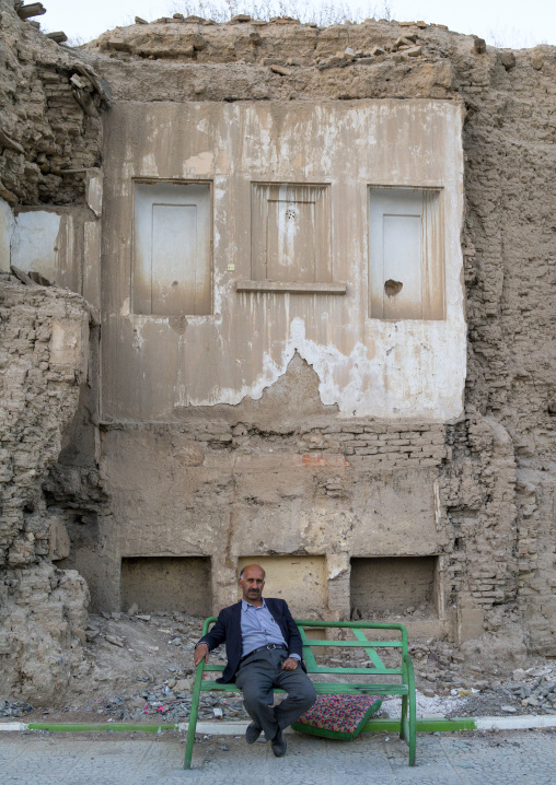 Man Sitting In Front Of A Ruined Wall, Kermanshah, Iran