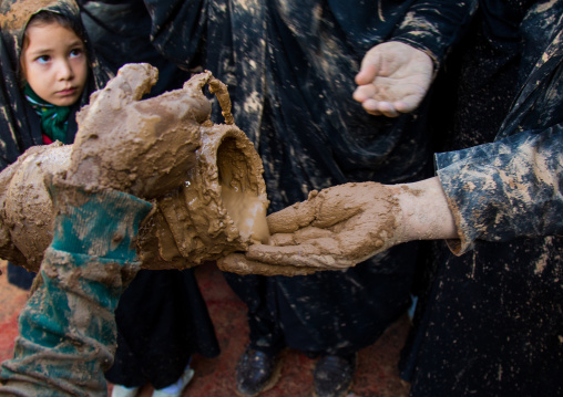 Iranian Shiite Muslim Women Covering Themselves In Mud During Ashura, The Day Of The Death Of Imam Hussein, Kurdistan Province, Bijar, Iran