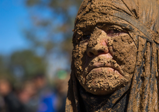 Iranian Shiite Muslim Woman Covered In Mud During Ashura, The Day Of The Death Of Imam Hussein, Kurdistan Province, Bijar, Iran