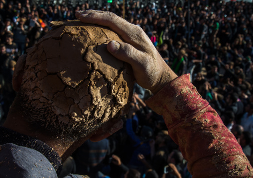 Iranian Shiite Muslim Man Covered In Mud Lokking At The Crowd During Ashura Day, Kurdistan Province, Bijar, Iran