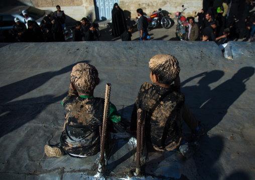 Iranian Shiite Muslim Boys Covered In Mud, Chanting And Self-flagellating During Ashura Day, Kurdistan Province, Bijar, Iran
