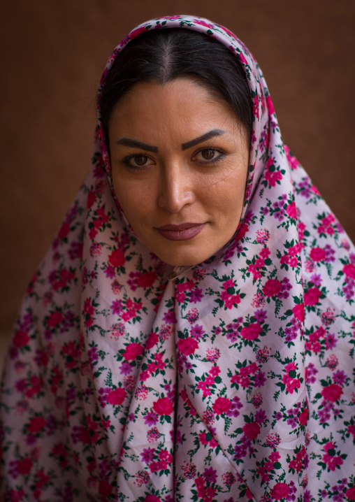 Portrait Of An Iranian Woman Wearing Traditional Floreal Chador In Zoroastrian Village, Isfahan Province, Abyaneh, Iran