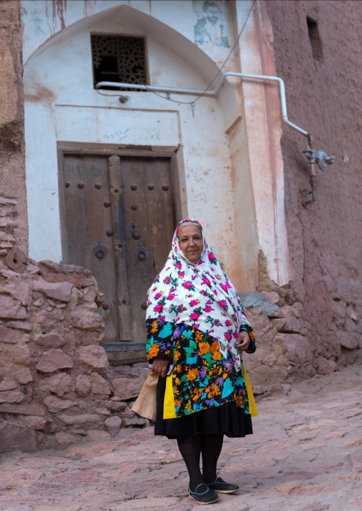 Portrait Of An Iranian Woman Wearing Traditional Floreal Chador In Zoroastrian Village, Isfahan Province, Abyaneh, Iran