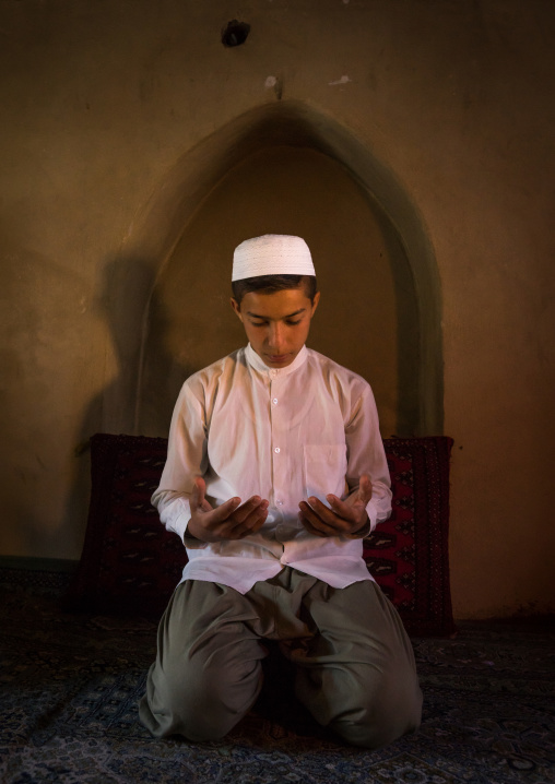 Iranian Shiite Muslim Student Praying In A Madrassah, Golestan Province, Karim Ishan, Iran