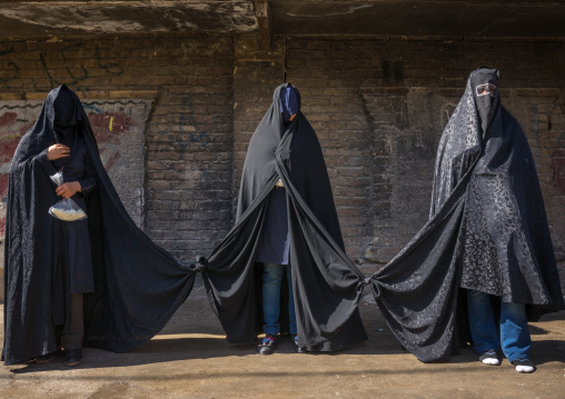Iranian Shiite Women Mourning Hussein On Tasua Day With Their Faces Covered And Their Clothes Tied As They Must Not Speak, Lorestan Province, Khorramabad, Iran