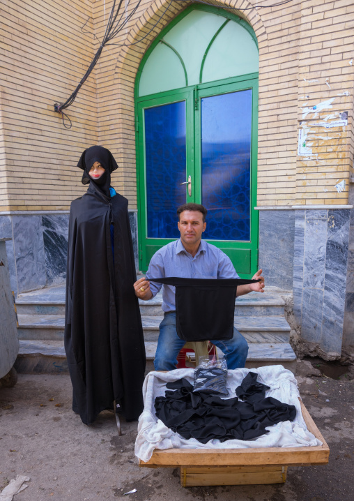 Man Selling Chadors And Veils During Chehel Menbari Festival On Tasua Day, Lorestan Province, Khorramabad, Iran