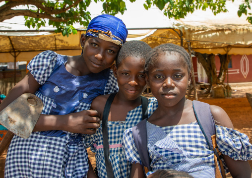 Portrait of three african girl in the street, Région des Lacs, Yamoussoukro, Ivory Coast