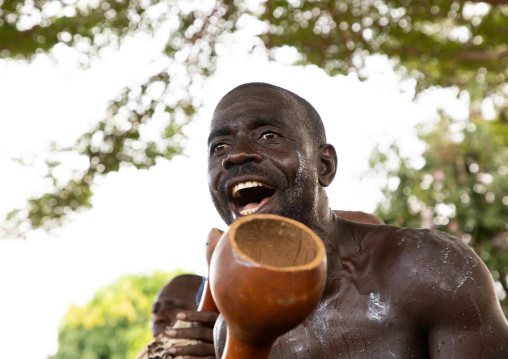 Musician performing during a Goli sacred mask dance in Baule tribe, Région des Lacs, Bomizanbo, Ivory Coast