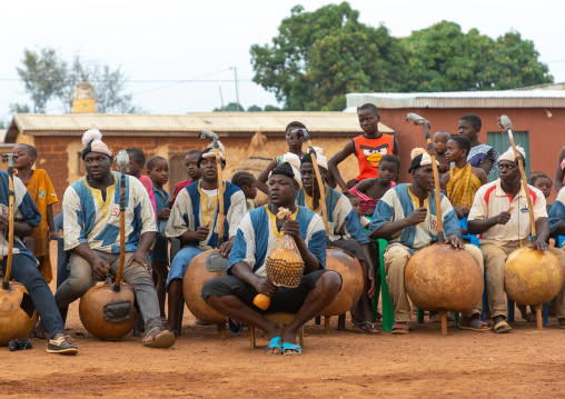 African musicians playing koras during Boloye dance of the panther man, Savanes district, Waraniene, Ivory Coast
