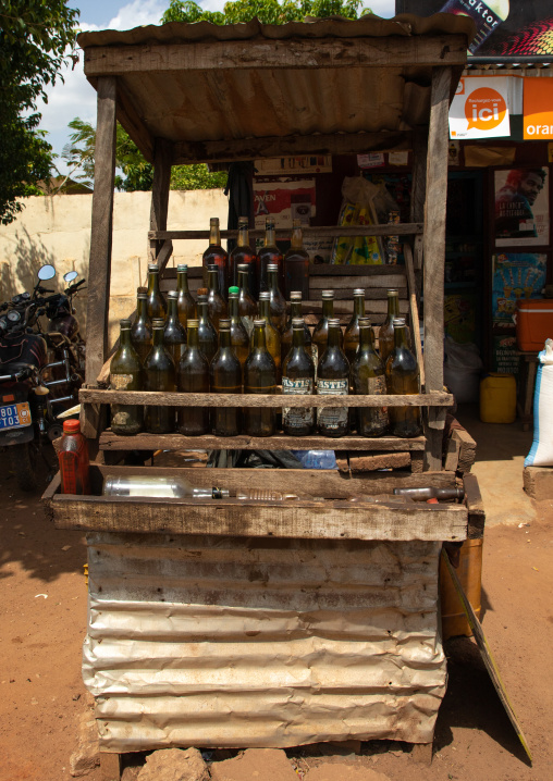 African gas station selling gasoline in bottles along the road, Poro region, Korhogo, Ivory Coast
