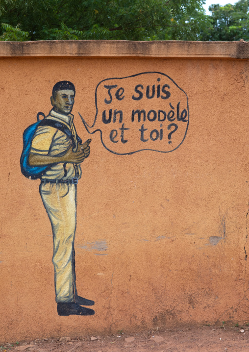 Mural depicting a pupil who works well at school, Savanes district, Boundiali, Ivory Coast