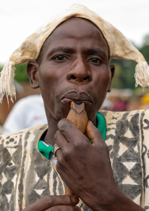 Senufo man using a flute during the Ngoro dance, Savanes district, Ndara, Ivory Coast