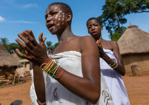 Dan tribe young women clapping hands and dancing during a ceremony, Bafing, Gboni, Ivory Coast