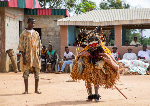 We Guere sacred mask dance in front of the village leaders during a ceremony, Guémon, Bangolo, Ivory Coast