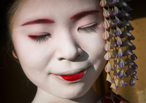 Portrait of a 16 years old maiko called chikasaya with closed eyes, Kansai region, Kyoto, Japan