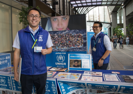 Unhcr charity volunteers on street collecting money for refugees, Kanto region, Tokyo, Japan