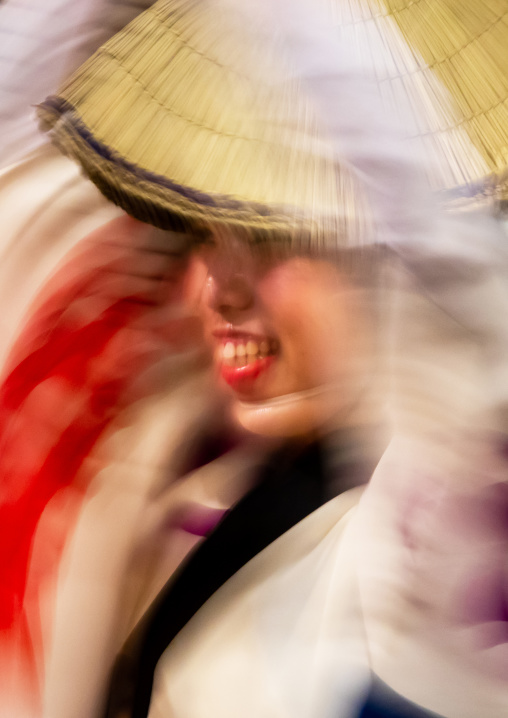 Japanese woman with straw hats during the Koenji Awaodori dance summer street festival, Kanto region, Tokyo, Japan