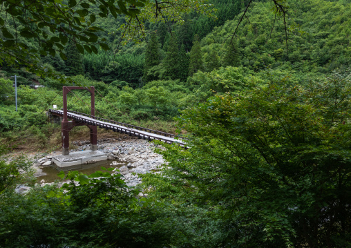 Wooden bridge in forest, Kyoto Prefecture, Miyama, Japan