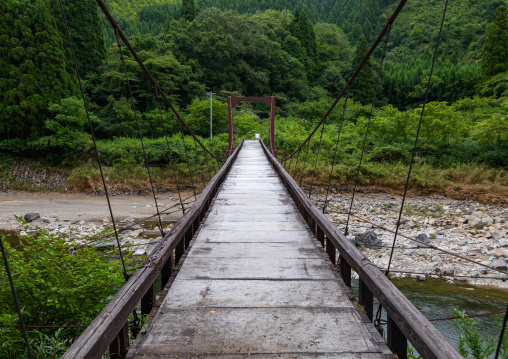 Wooden bridge in forest, Kyoto Prefecture, Miyama, Japan