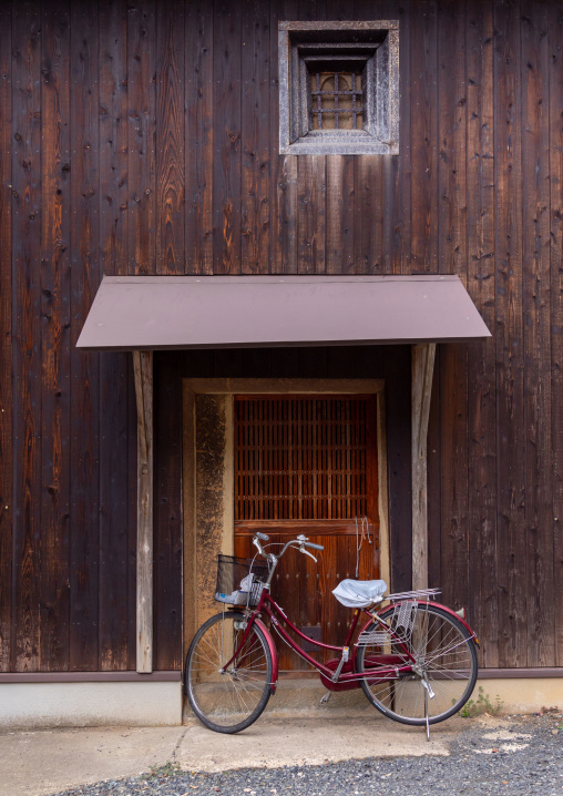 Bicycle parked in front of a funaya house, Kyoto prefecture, Ine, Japan