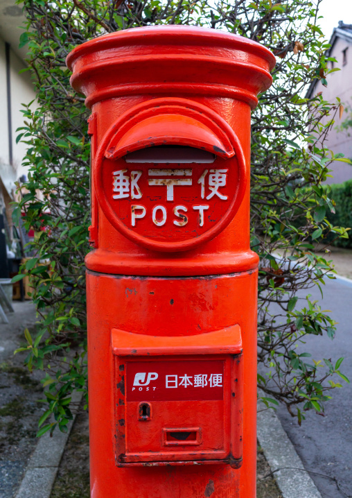 Japan post red mailbox in the street, Ishikawa Prefecture, Kanazawa, Japan