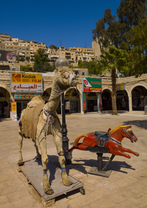 Kids Playfround With Camel In Amman, Jordan