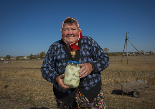 Old Woman Selling Mushrooms In Burabay, Kazakhstan