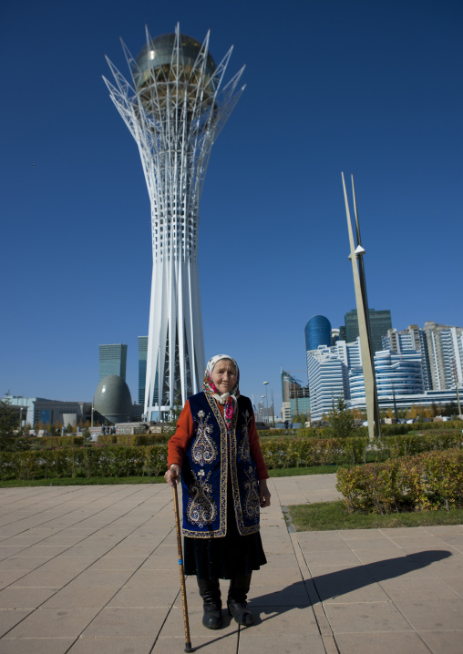 Old Woman In Front Of Baiterek Tower, Astana, Kazakhstan