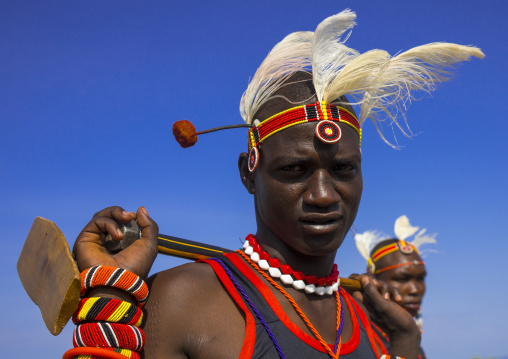 Turkana tribesman holding his wood pillow, Turkana lake, Loiyangalani, Kenya