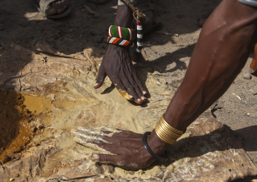 Man taking clay to use as make up in dassanech tribe, Turkana lake, Loiyangalani, Kenya
