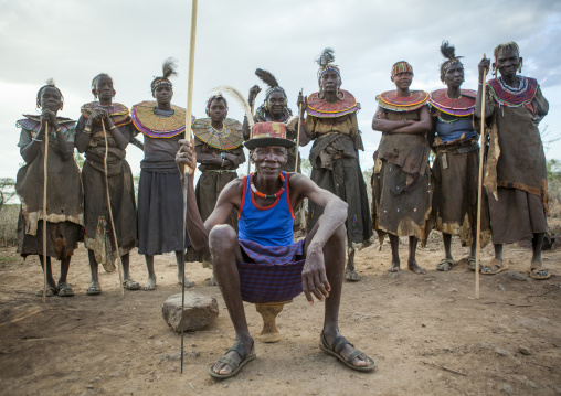 Pokot tribe people man pausing in front of the women, Baringo county, Baringo, Kenya