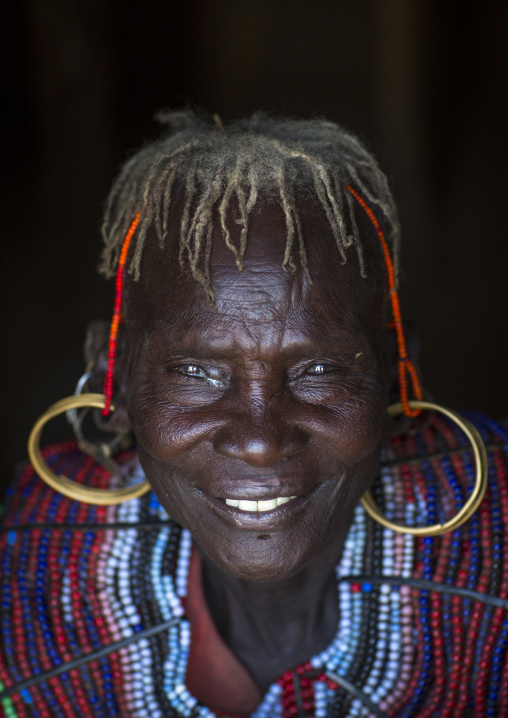 A pokot woman wears large necklaces made from the stems of sedge grass, Baringo county, Baringo, Kenya