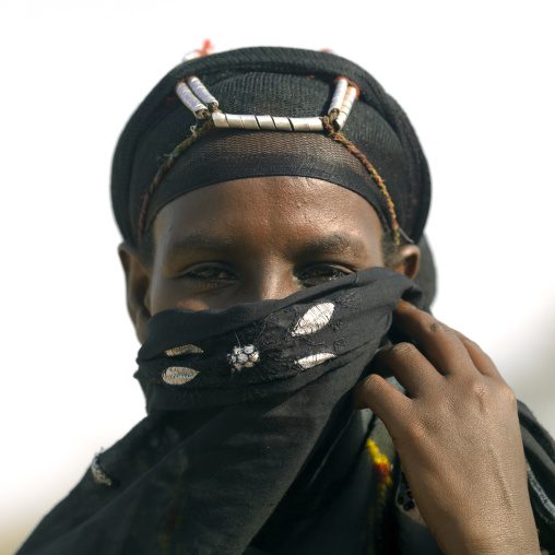 Portrait of a Gabra tribe woman with a veil hiding her face, Marsabit County, Chalbi Desert, Kenya