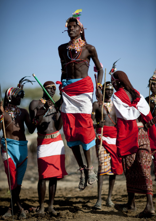 Samburu tribe warriors jumping during a ceremony, Samburu County, Maralal, Kenya