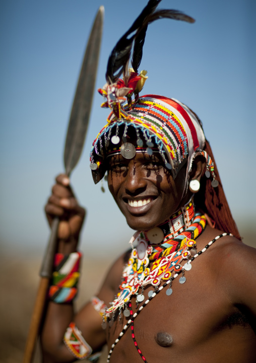 Portrait of a smiling Samburu tribe warrior with beaded headwear, Samburu County, Maralal, Kenya