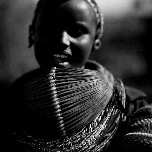 Rendille tribeswoman wearing traditional headdress and mpooro engorio necklace, Marsabit district, Ngurunit, Kenya