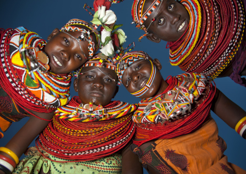 Rendille tribeswomen in circle looking down, Marsabit district, Ngurunit, Kenya